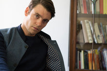 Nehru Gilet Made in England from Blue British Lambswool and a contrast Nehru collar in navy wool. Known as Nehru Vest, Nehru Waistcoat, Nehru Gilet. Finished with horn buttons. British designer, British menswear, Made in England. Smart casual Menswear.