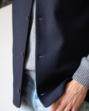 Nehru Gilet Made in England from Navy British Lambswool and a contrast Nehru collar in navy herringbone tweed. Known as Nehru Vest, Nehru Waistcoat, Nehru Gilet. Finished with horn buttons. British designer, British menswear, Made in England. Smart casual Menswear.