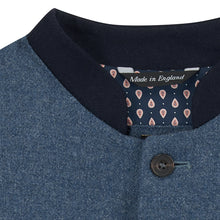 Nehru Gilet Made in England from Blue British Lambswool and a contrast Nehru collar in navy wool. Known as Nehru Vest, Nehru Waistcoat, Nehru Gilet. Finished with horn buttons. British designer, British menswear, Made in England. Smart casual Menswear.