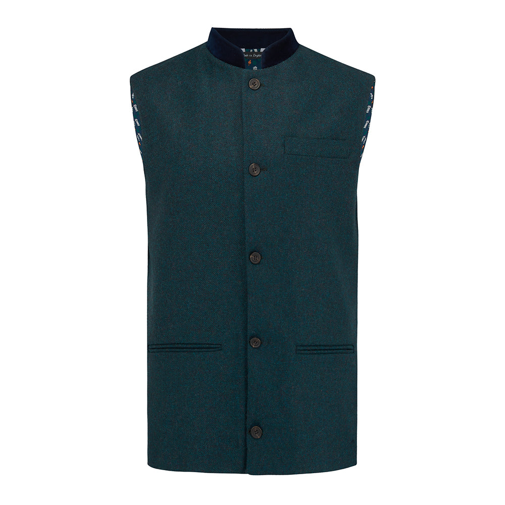 Nehru Gilet Made in England from Green Lambswool and a contrast Nehru collar in navy velvet. Known as Nehru Vest, Nehru Waistcoat, Nehru Gilet. Finished with horn buttons. British designer, British menswear, Made in England. Smart casual Menswear.
