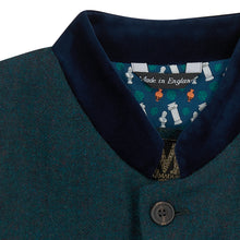 Nehru Gilet Made in England from Green Lambswool and a contrast Nehru collar in navy velvet. Known as Nehru Vest, Nehru Waistcoat, Nehru Gilet. Finished with horn buttons. British designer, British menswear, Made in England. Smart casual Menswear.