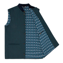 Nehru Gilet Made in England from Green Lambswool and a contrast Nehru collar in navy velvet. Known as Nehru Vest, Nehru Waistcoat, Nehru Gilet. Finished with horn buttons. British designer, British menswear, Made in England. Smart casual Menswear. 